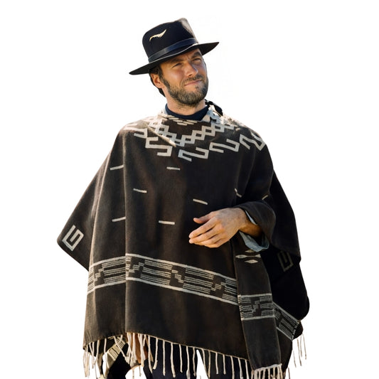 Man wearing a black poncho with white patterns and a matching hat on a white background