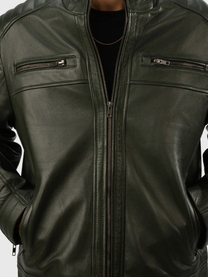 Green leather jacket with zippers on a white background