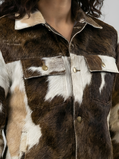 Close-up of a brown and white fur jacket with gold buttons.