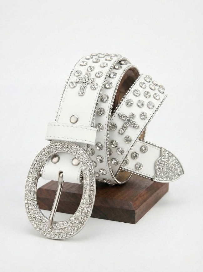 White belt with silver embellishments on a wooden block against a white background