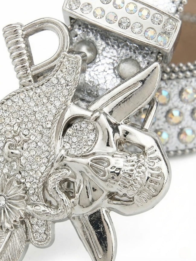 Silver decorative item with intricate designs and gemstones on a white background