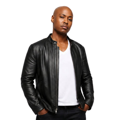 Man wearing a black leather jacket over a white shirt on a white background