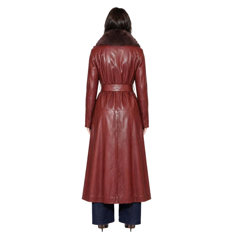 Person wearing a long brown leather coat on a white background