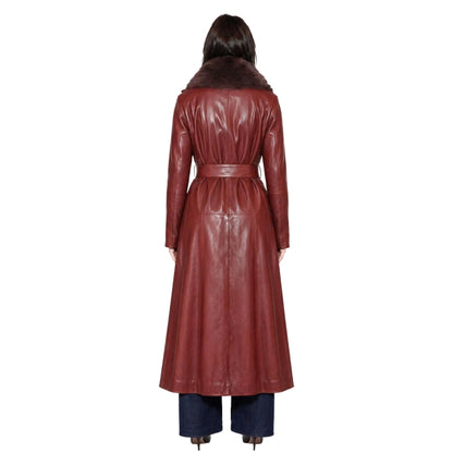 Person wearing a long brown leather coat on a white background