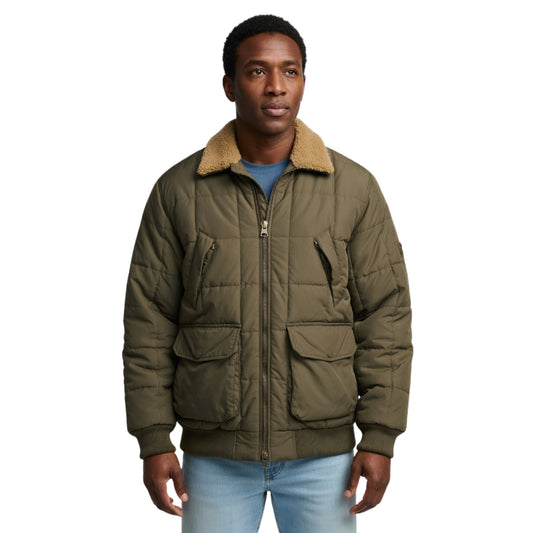 Man wearing a green quilted jacket with a beige fur collar on a white background