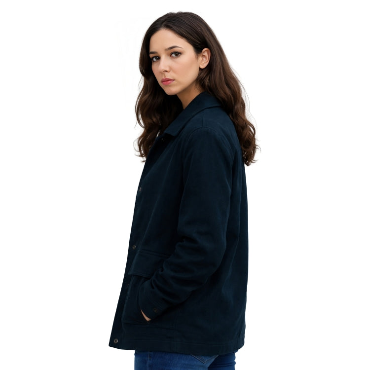Woman wearing a dark green coat on a white background