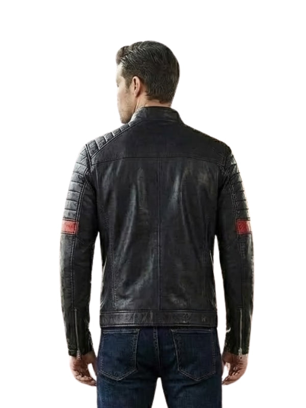 Man wearing a black leather jacket with red accents on a white background