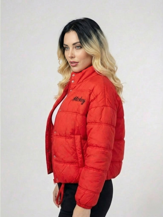 Woman wearing a red puffer jacket with 'Mickey' branding on a white background