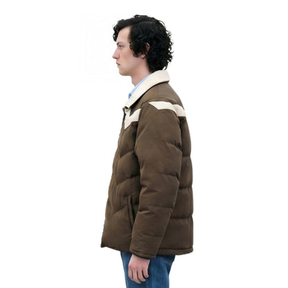 Person wearing a brown puffer jacket with white lining on a white background