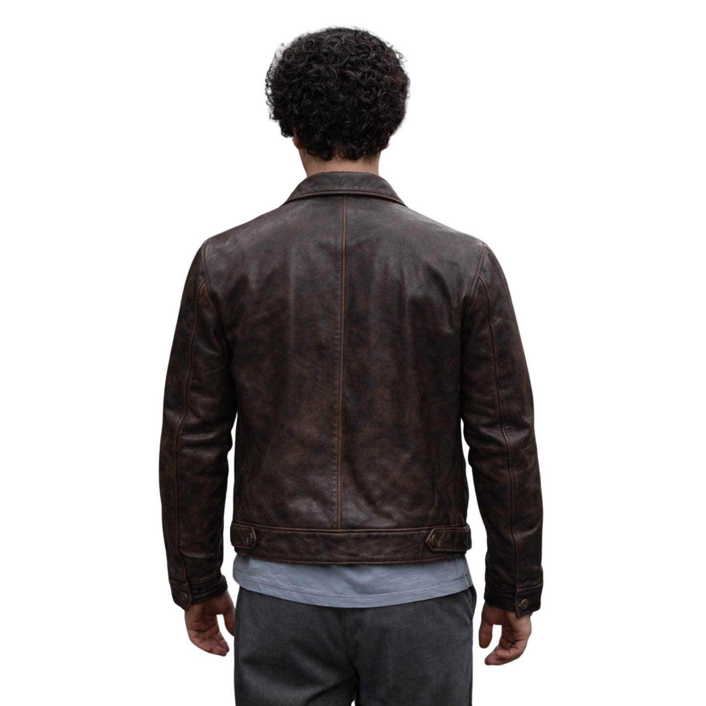 Person wearing a brown leather jacket on a white background