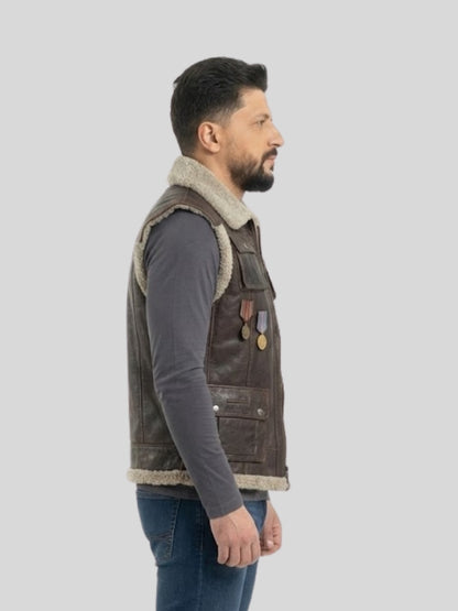 Man wearing a brown leather vest with fur lining on a light gray background