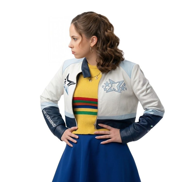 Woman wearing a colorful jacket with star designs and a yellow sweater with rainbow stripes on a white background