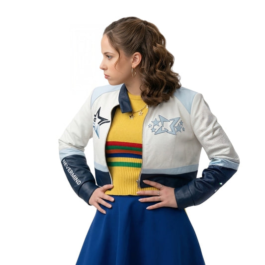 Woman wearing a colorful jacket with star designs and a yellow sweater with rainbow stripes on a white background