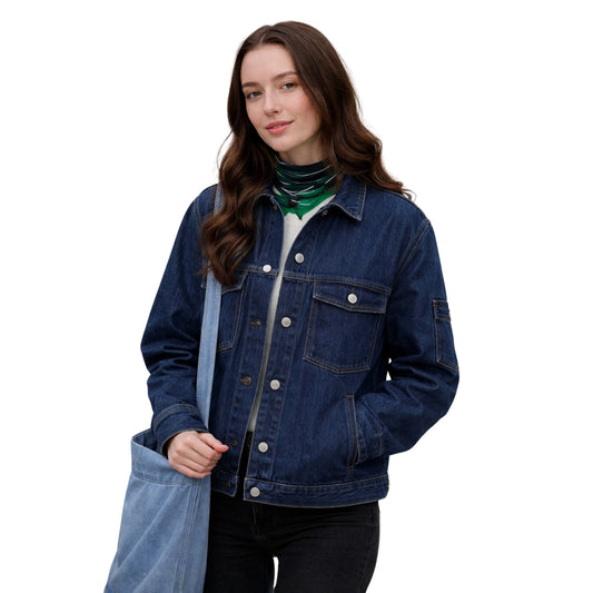 Woman wearing a blue denim jacket holding a blue tote bag on a white background