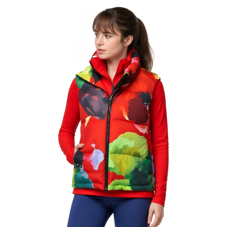Woman wearing a colorful puffer vest with a white background