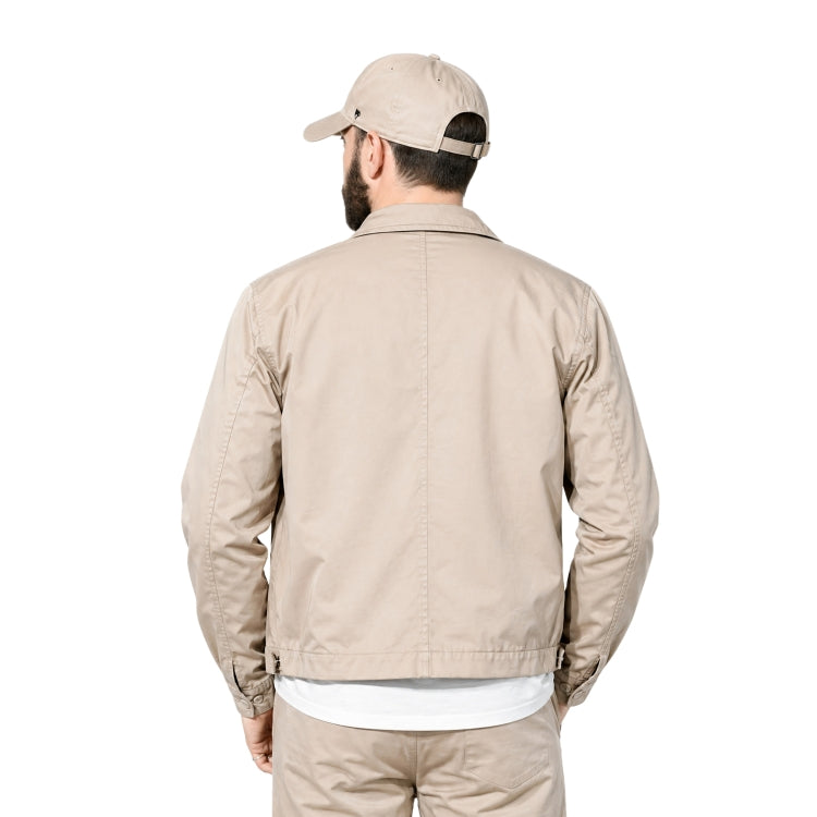 Man wearing a beige bomber jacket 