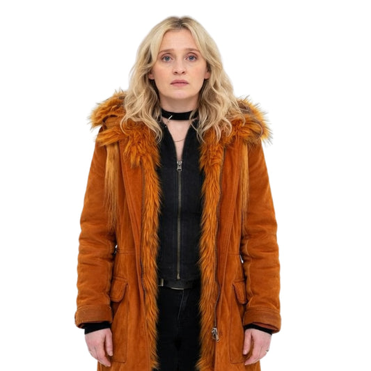 Person wearing a brown fur-lined coat on a white background