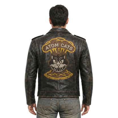 Man wearing a leather jacket with 'Atom Cats' design on the back
