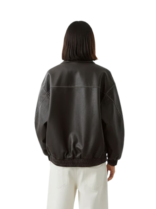 Person wearing a black leather jacket on a white background