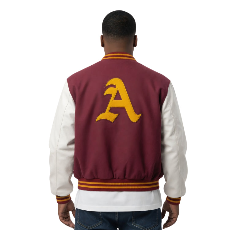 Person wearing a maroon and white varsity jacket with a yellow letter 'A' on the back.