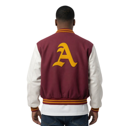 Person wearing a maroon and white varsity jacket with a yellow letter 'A' on the back.