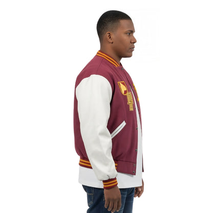 Man wearing a maroon and white varsity jacket with a logo on a white background