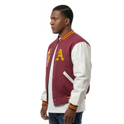 Man wearing a maroon and white varsity jacket with yellow lettering on a white background