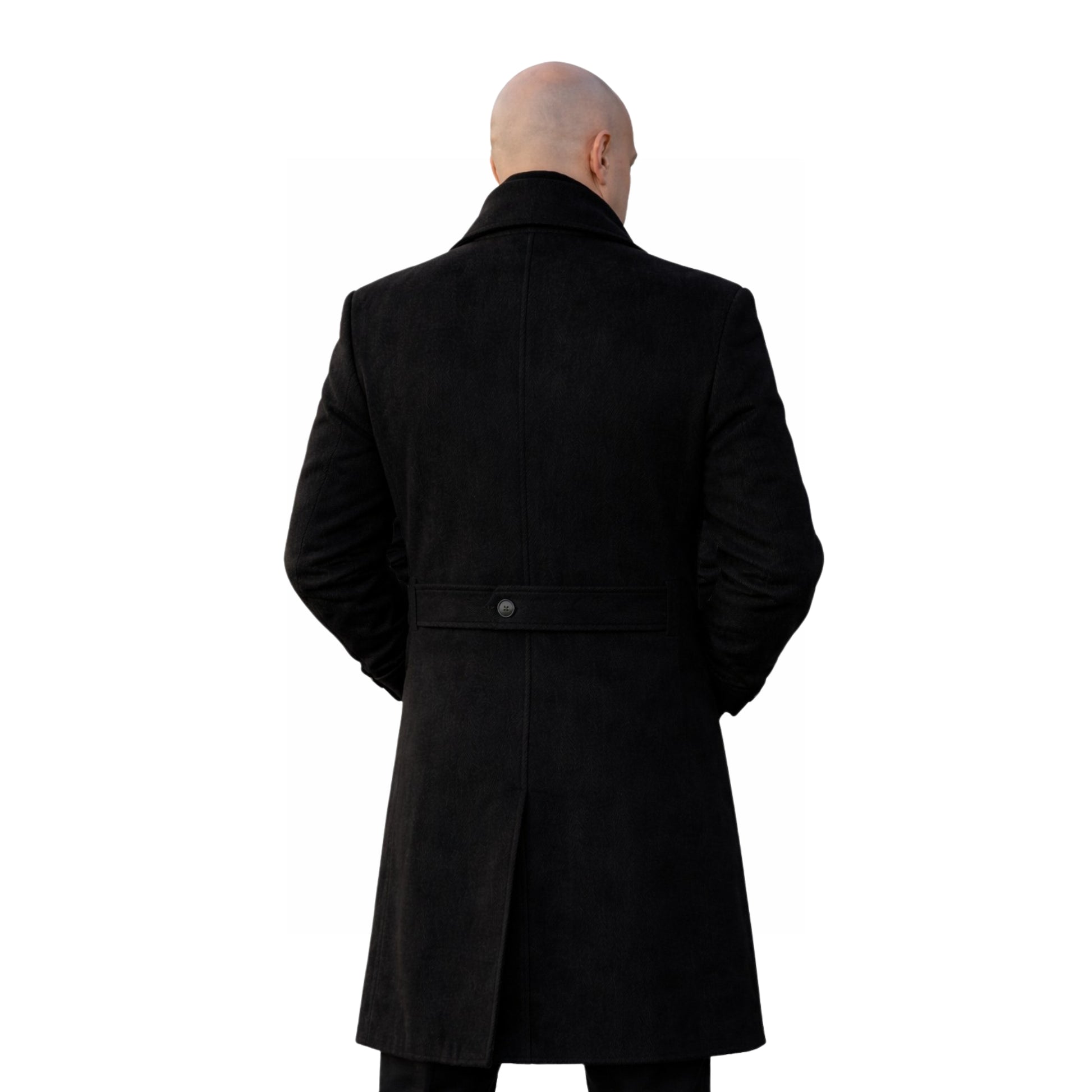 Person wearing a black coat from behind on a white background