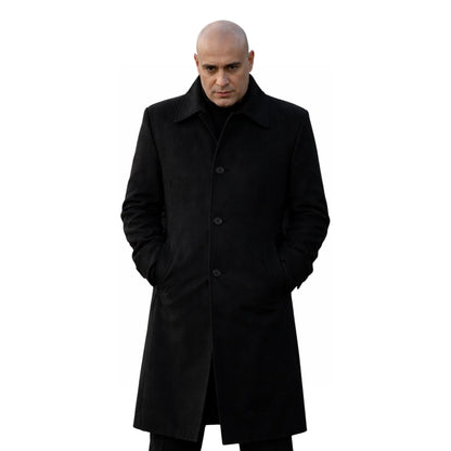 Man wearing a black coat on a white background