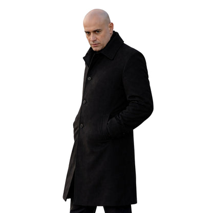 Man wearing a black coat on a white background
