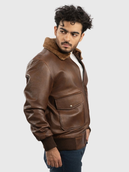 Man wearing a brown leather jacket with fur collar on a white background