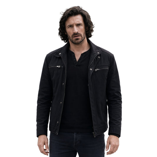 Man wearing a black jacket over a black shirt on a white background