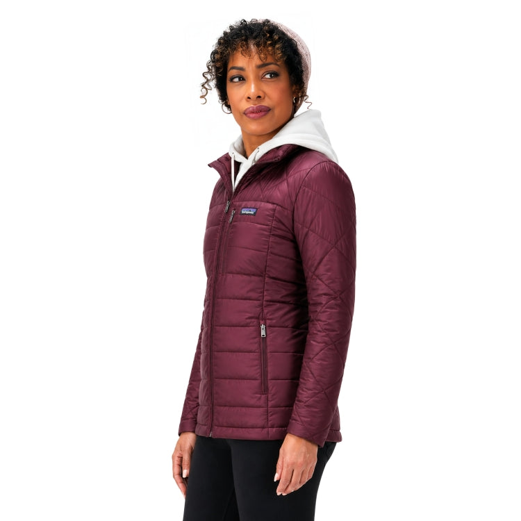 Woman wearing a maroon quilted jacket with a white hood on a white background
