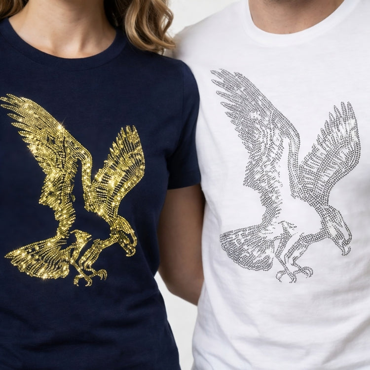Two shirts with eagle designs, one gold on navy and one silver on white, worn by people.