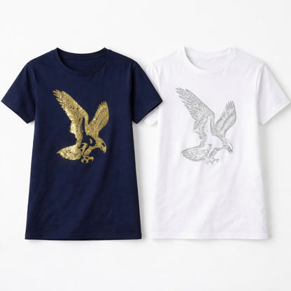 Navy blue t-shirt with gold eagle design and white t-shirt with silver eagle design on a white background