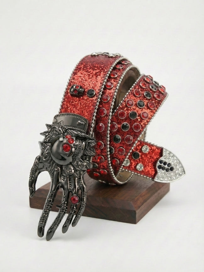 Red glittery belt with a decorative clasp on a white background