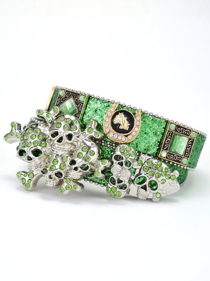 Green and silver decorative item with intricate designs on a white background
