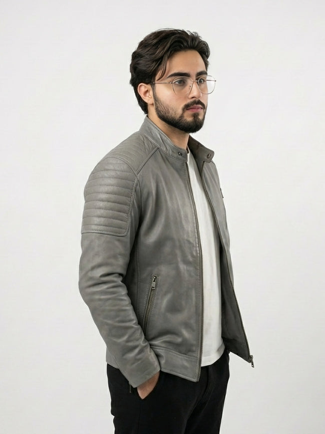 Man wearing a gray leather jacket on a white background