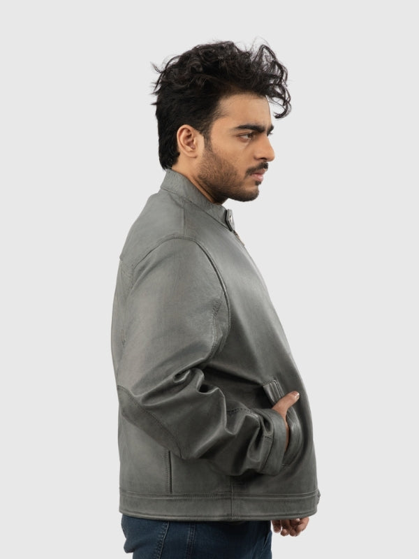 Man wearing a gray jacket on a white background