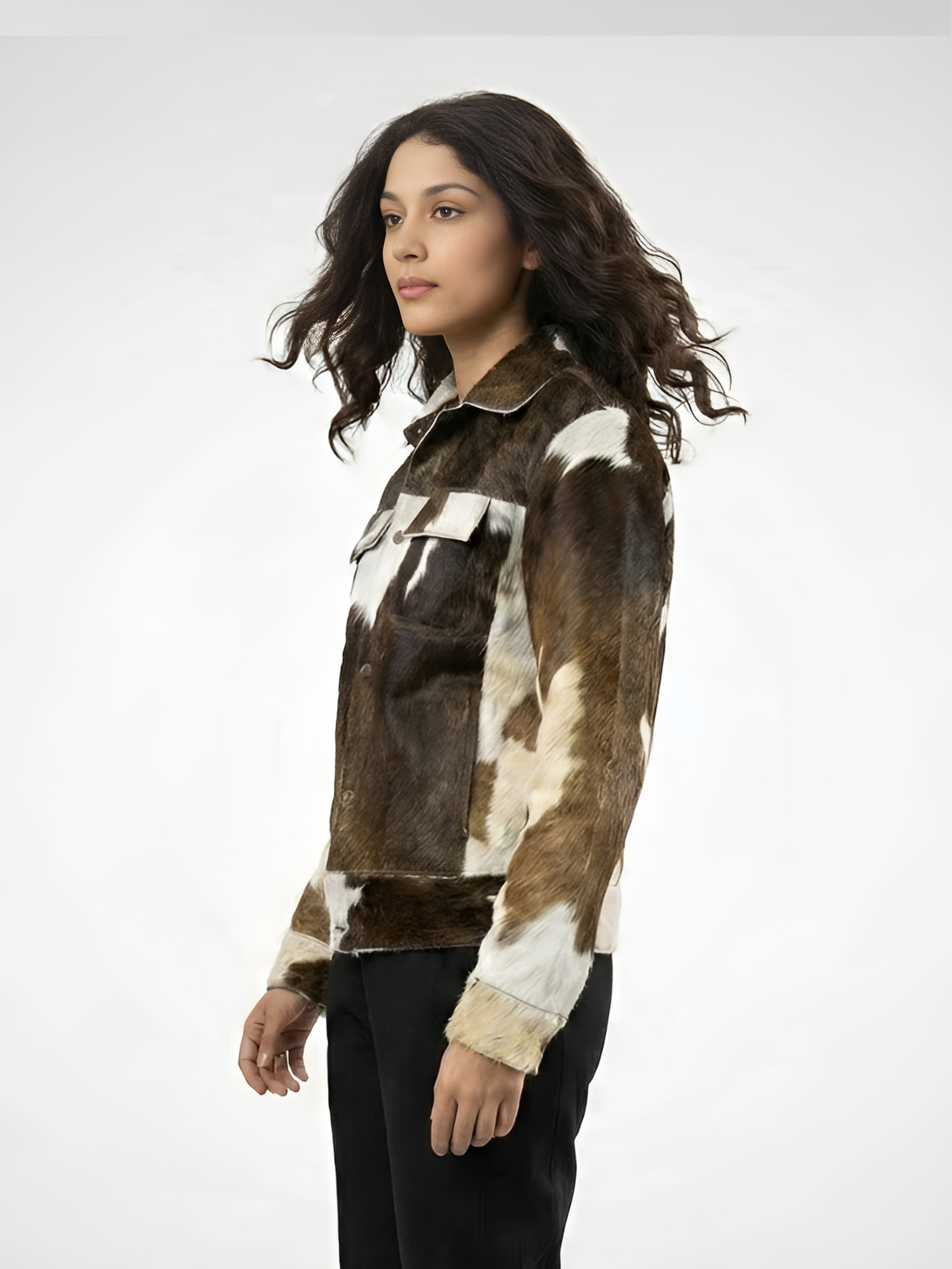 Woman wearing a cowhide leather jacket on a white background