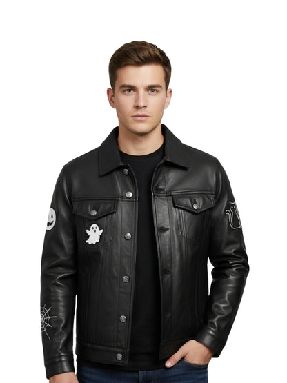 Man wearing a black leather jacket with ghost and spider web designs on sleeves against a white background