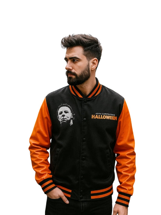 Man wearing a black and orange jacket with 'Halloween' text and logo.