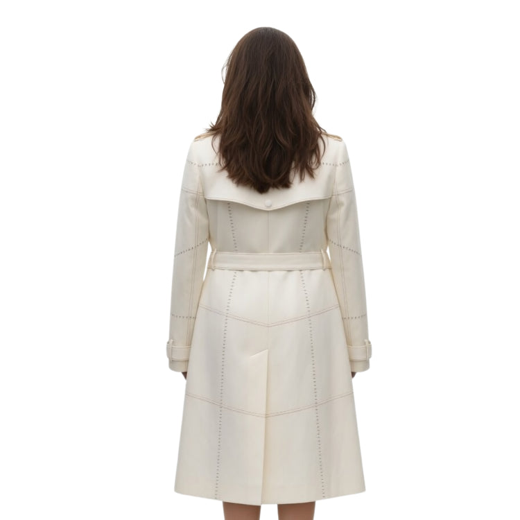 White quilted coat worn by a person on a white background