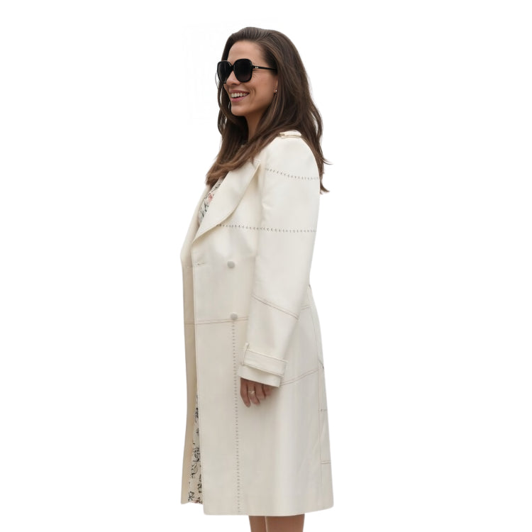 Woman wearing a white coat on a white background