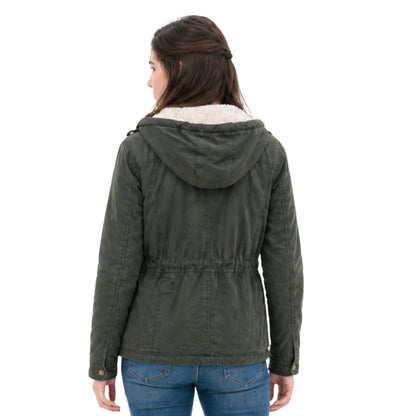 Person wearing a green hooded jacket with white lining on a white background