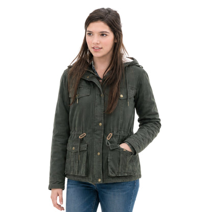 Woman wearing a green jacket on a white background