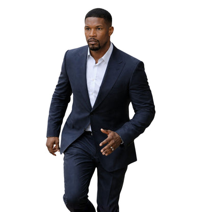 Man wearing a navy suit and white shirt on a white background