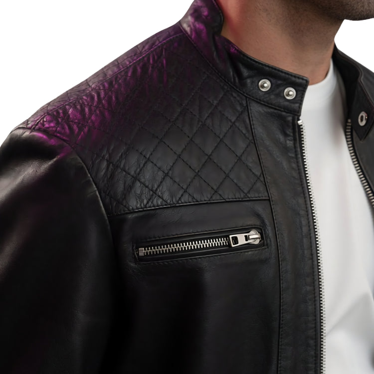 Black leather jacket with purple quilted panel on a white background