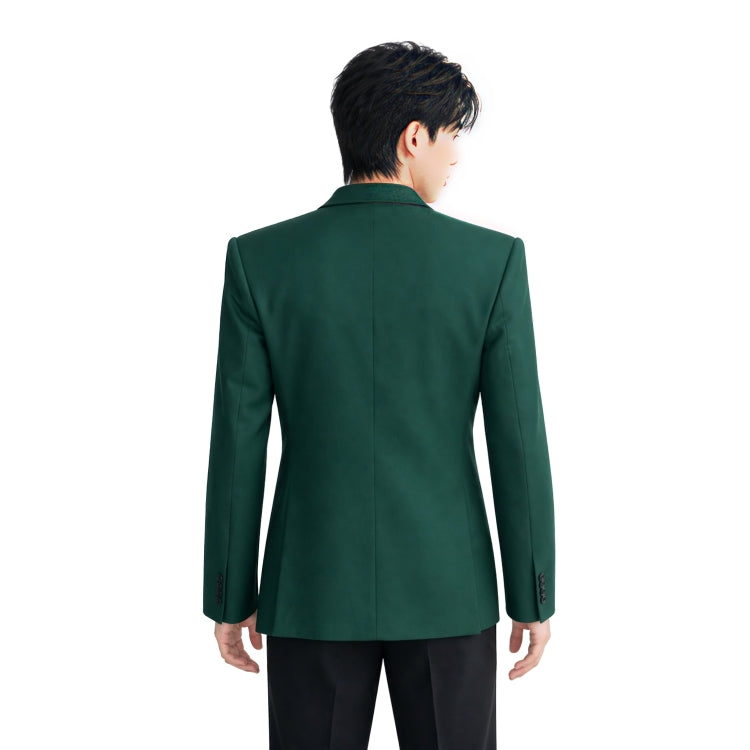 Green blazer worn by a person on a white background