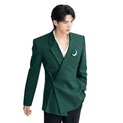 Person wearing a green blazer with a white shirt and black pants on a white background